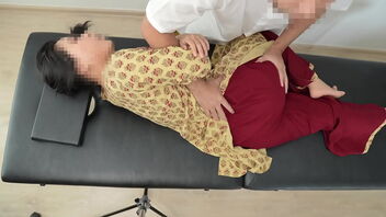 Pretty Asian woman gives a great massage with oil and shows her perfect behind.