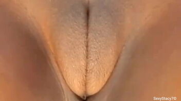 Stacy7 enjoys playing with her big and sensitive clit.